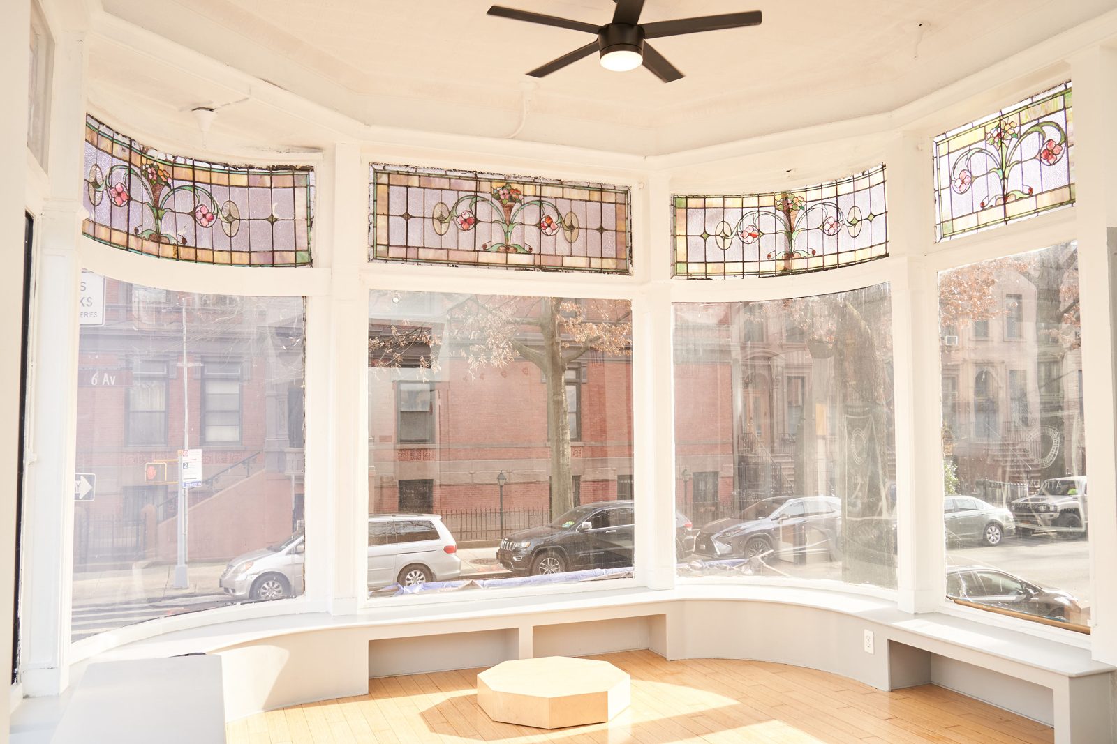 Curved bay windows with Tiffany stained glass