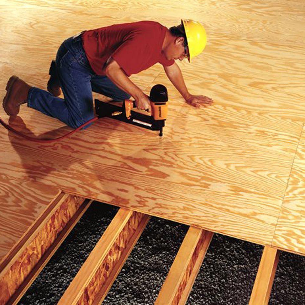 Tongue-and-groove plywood subfloor over wooden floor joists