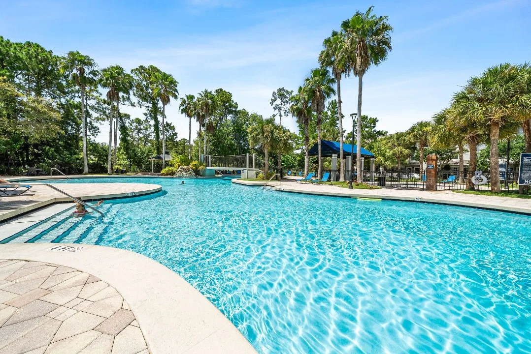 Community swimming pool shown in the SoLiving Property 4 gallery