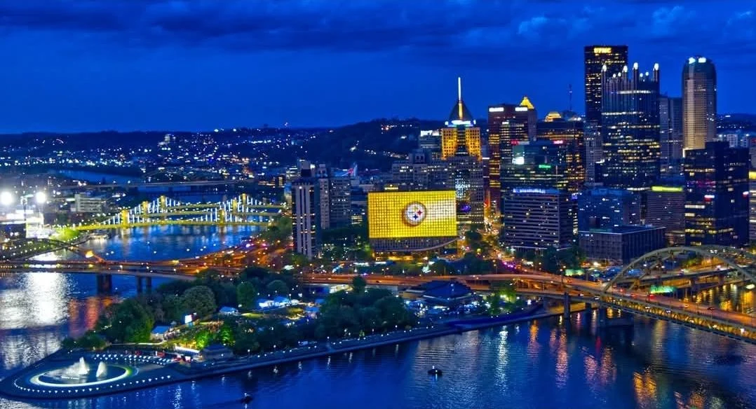 Downtown Pittsburgh skyline and rivers at night