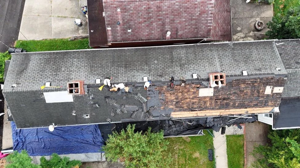 The worn shingle and flat roof sections before we started.