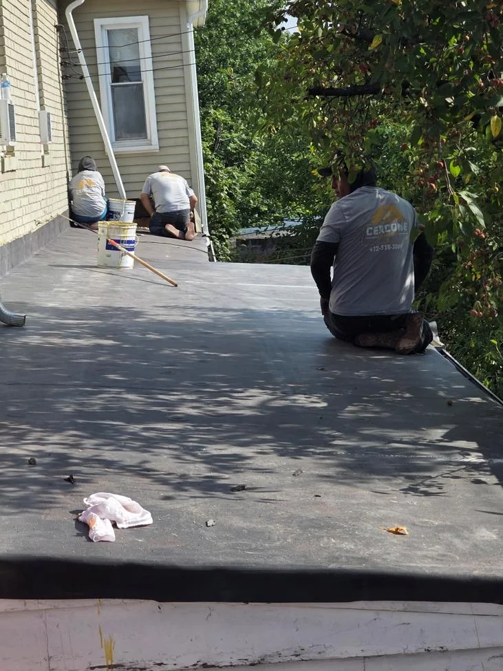 Cercone Exteriors crew working on a flat roof