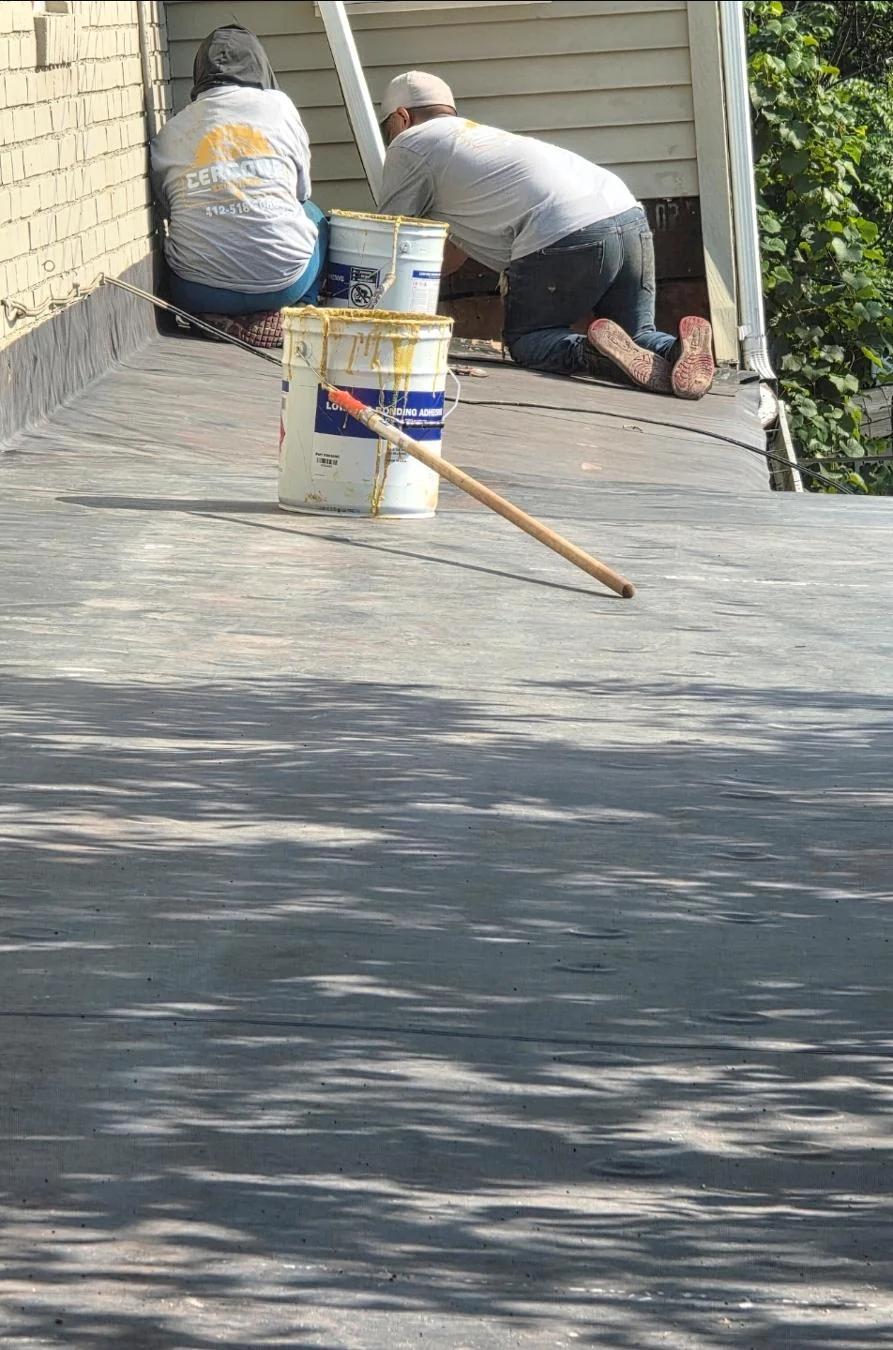 Our crew sealing the flat roof section.