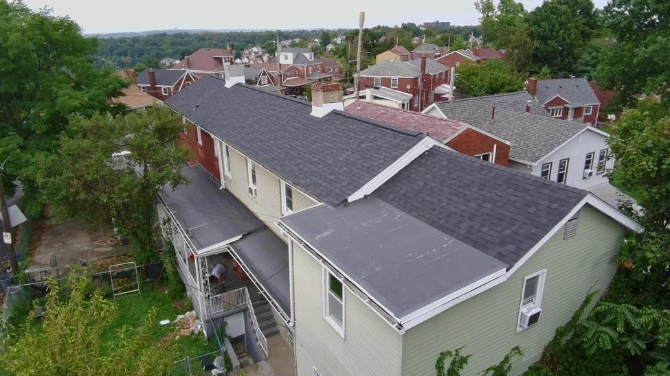 Finished roof replacement with new shingle and flat roof
