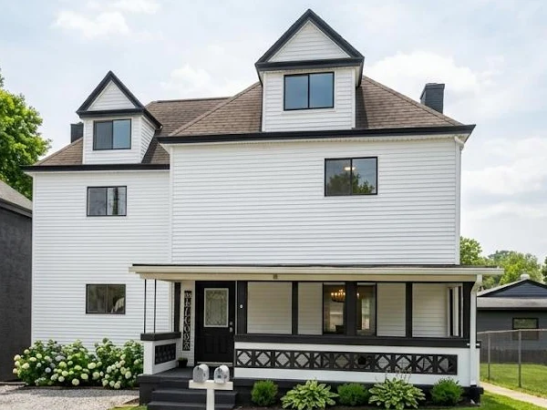 Same home after new white and black siding by Cercone Exteriors