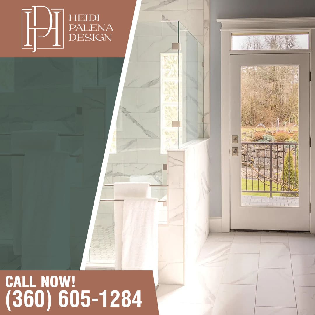 Bright modern bathroom with marble tile walls, glass shower enclosure, and exterior door view