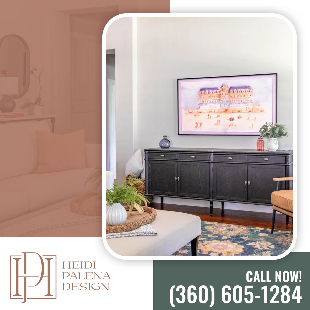 Styled living space featuring a black traditional wood credenza beneath a wall-mounted digital frame TV displaying beach landscape artwork, complete with floral accents and a patterned area rug.