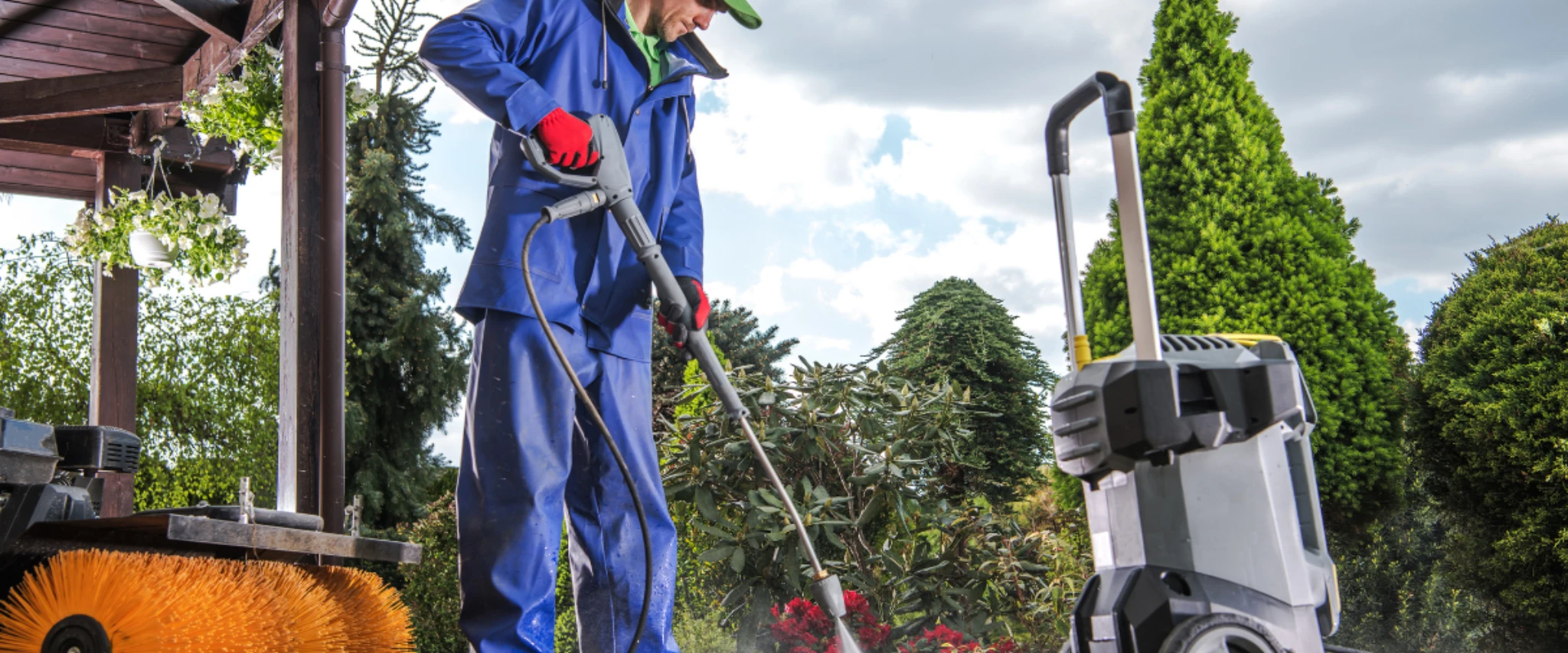 Professional cleaning a garden patio with a pressure washer on a sunny day. Professional cleaning a garden patio with a pressure washer on a sunny day.