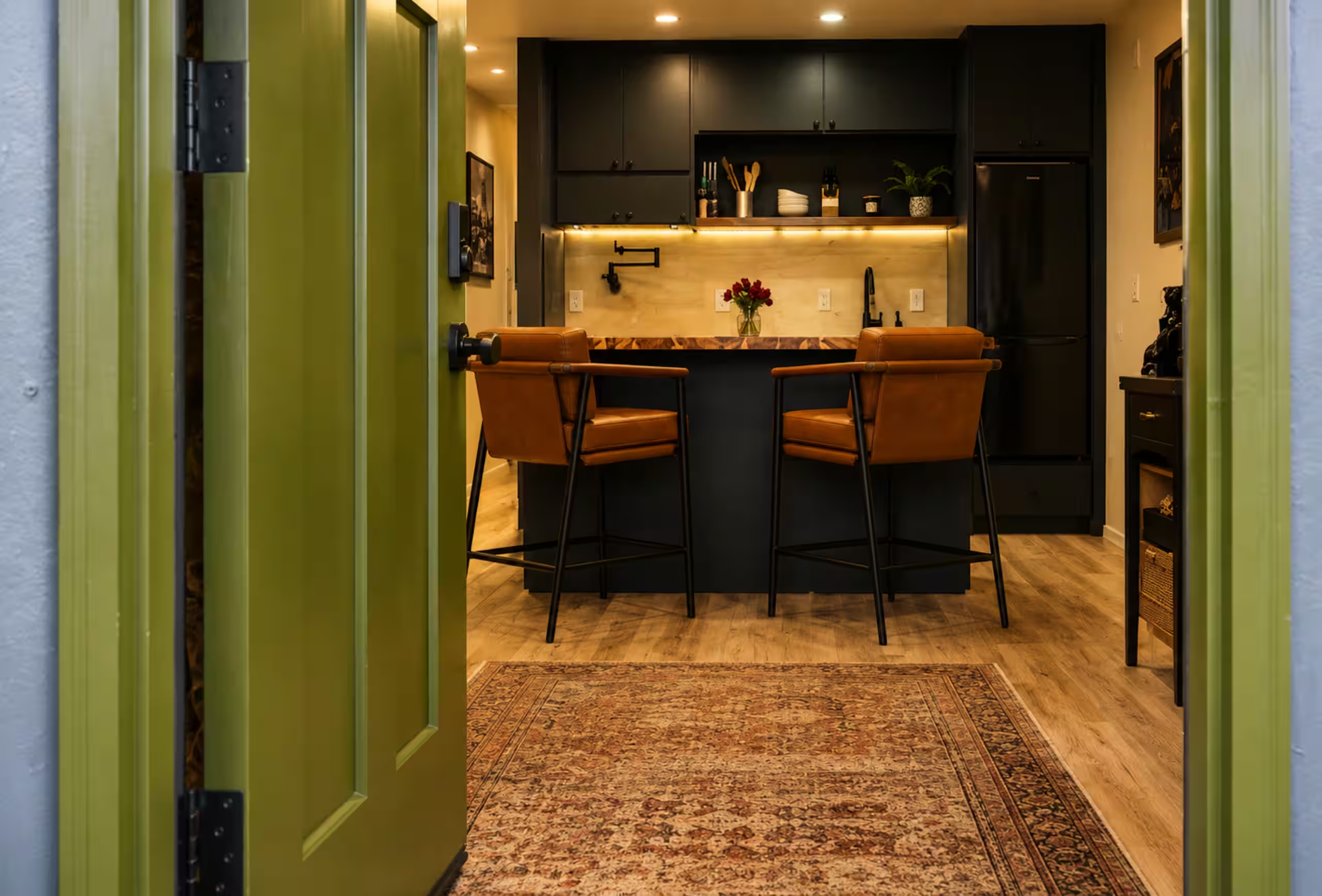 Concrete Rose STR living room with green doorway — Montgomery Alabama