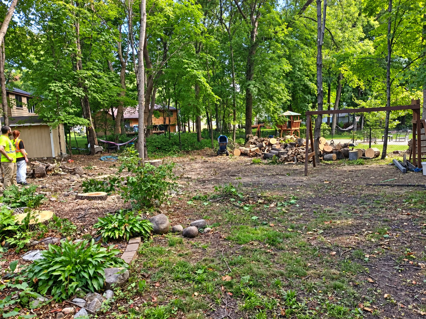 Tree debris and branches being hauled from a residential property