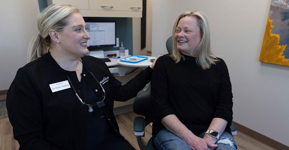 Woman holding invisalign