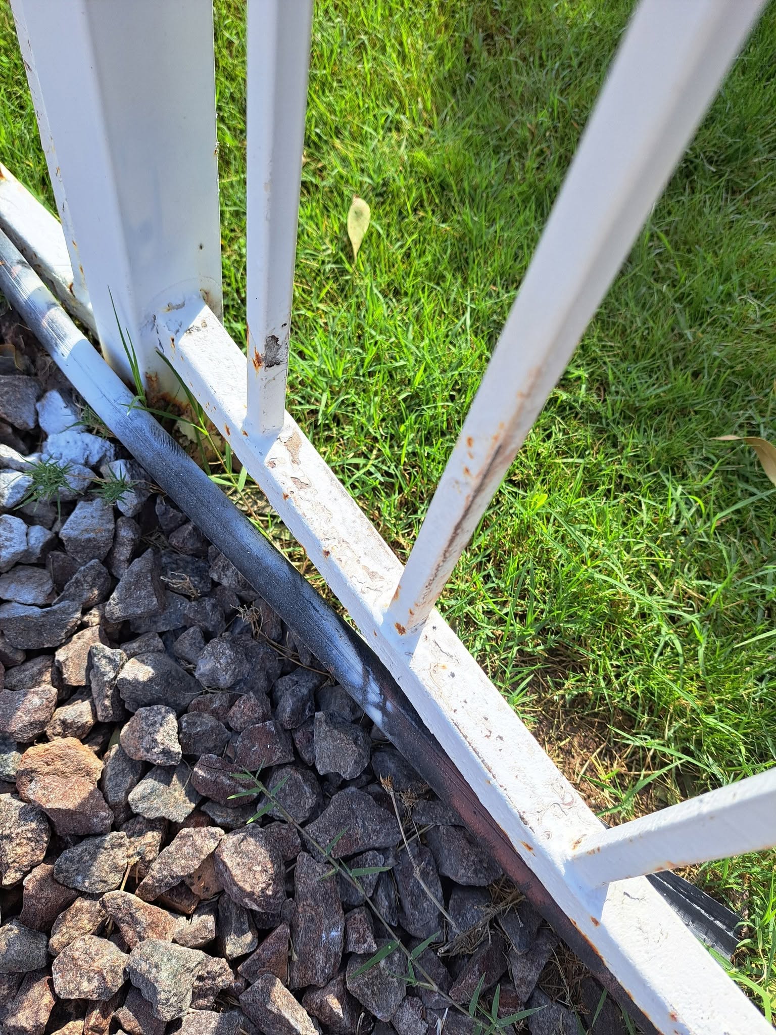 Fence before painting by Blankie Painting Co.