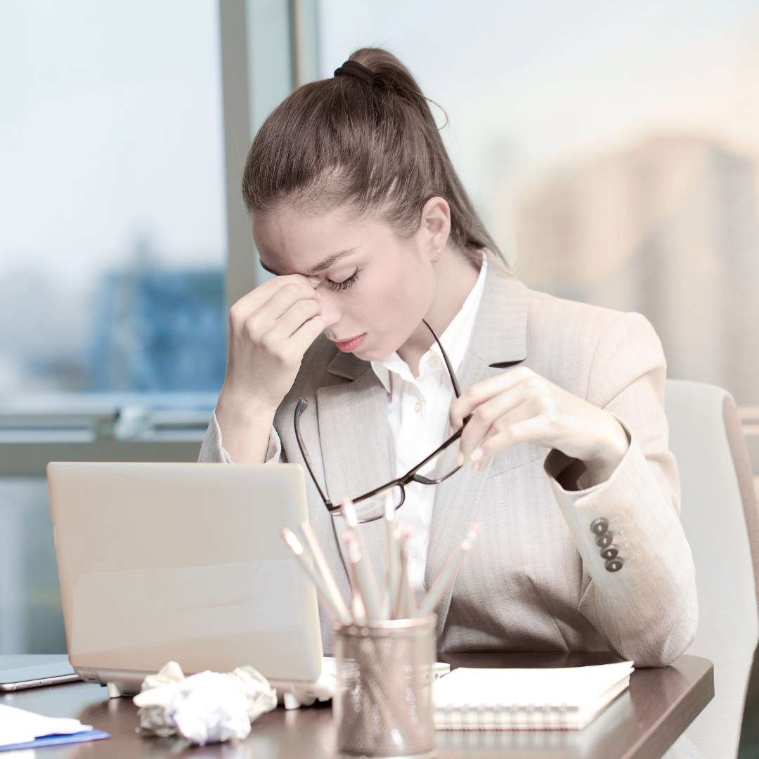 Woman feeling fatigued and overwhelmed, reflecting on health and body signals in a calm home environment Woman feeling fatigued and overwhelmed, reflecting on health and body signals in a calm home environment