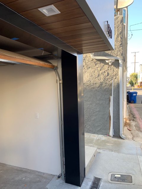 Installed soffit panels beneath a roof overhang