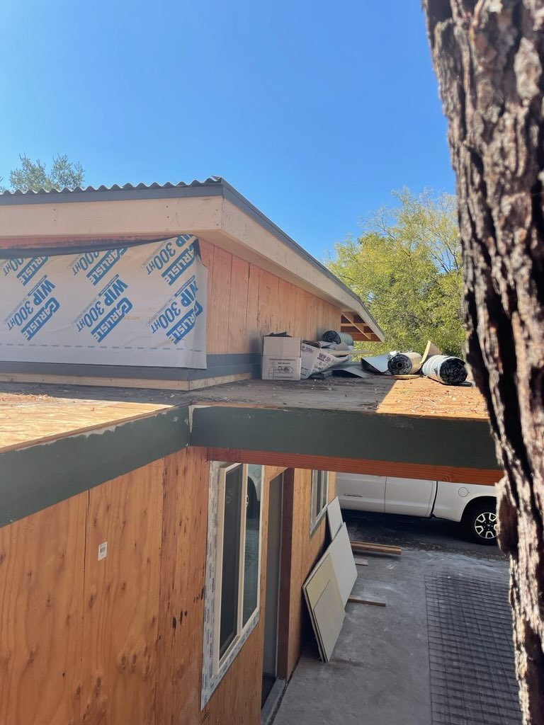 Close-up of a dark metal fascia panel installed on a modern home