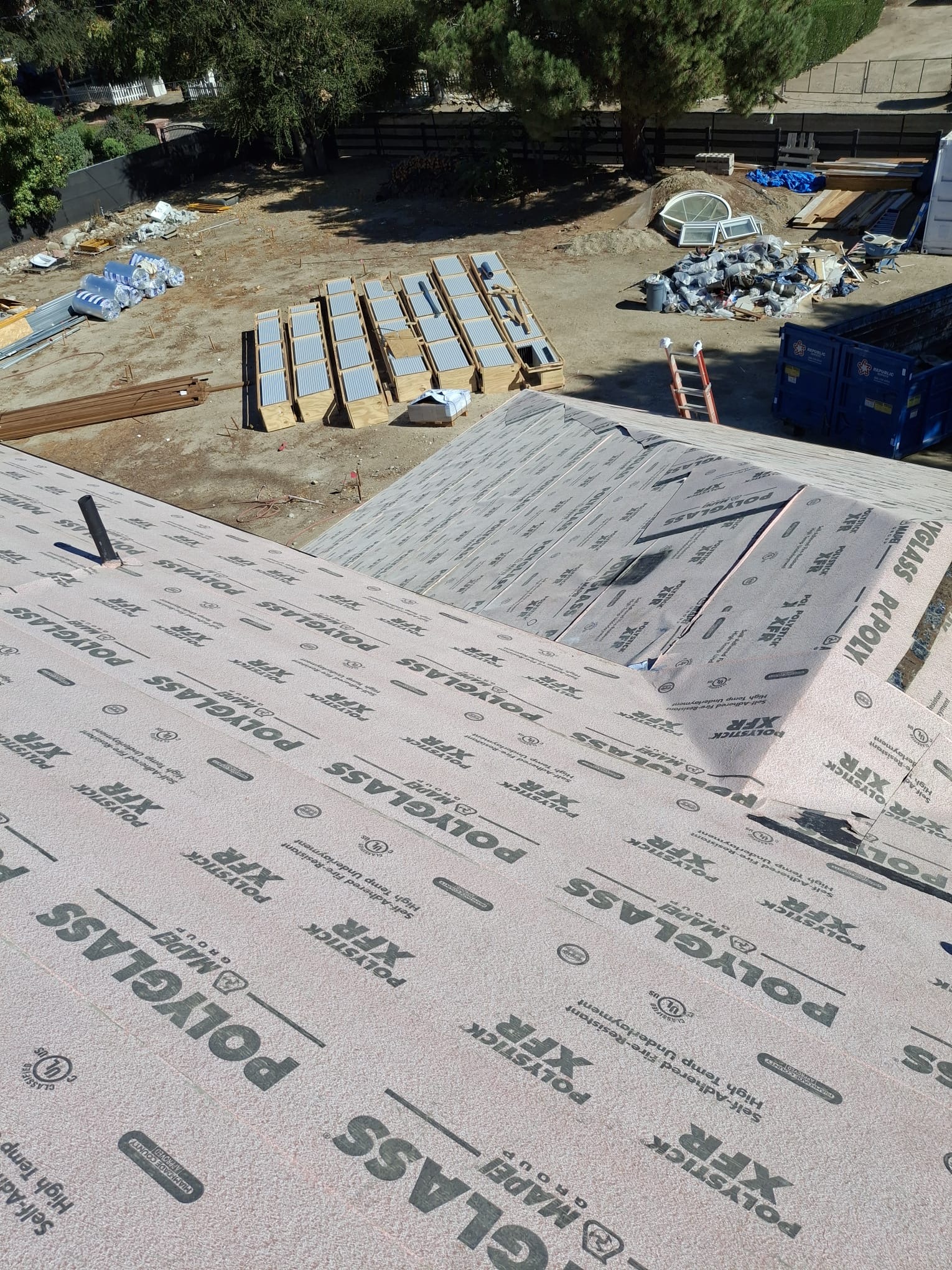Installed metal roof panel system on a property