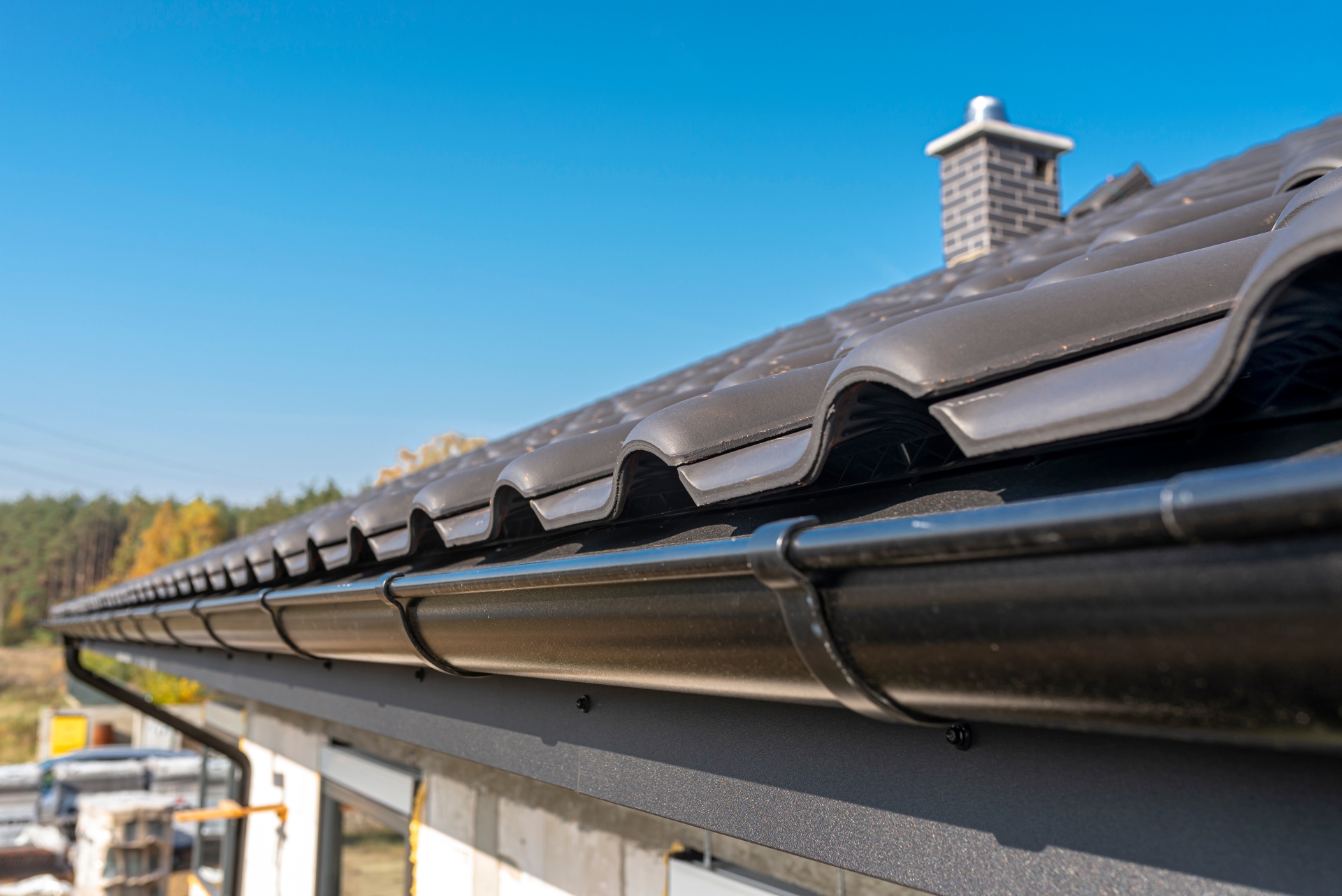 Installed metal rain gutter system on a residential property