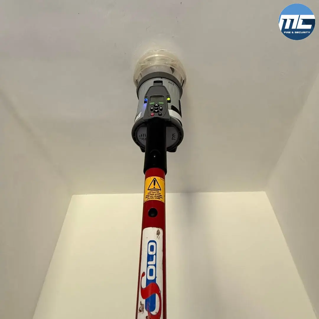 SOLO smoke detector test pole — fire alarm testing tool used by MC Fire & Security