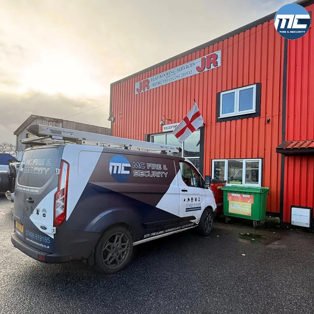 MC Fire & Security van outside an industrial unit — fire alarm takeover