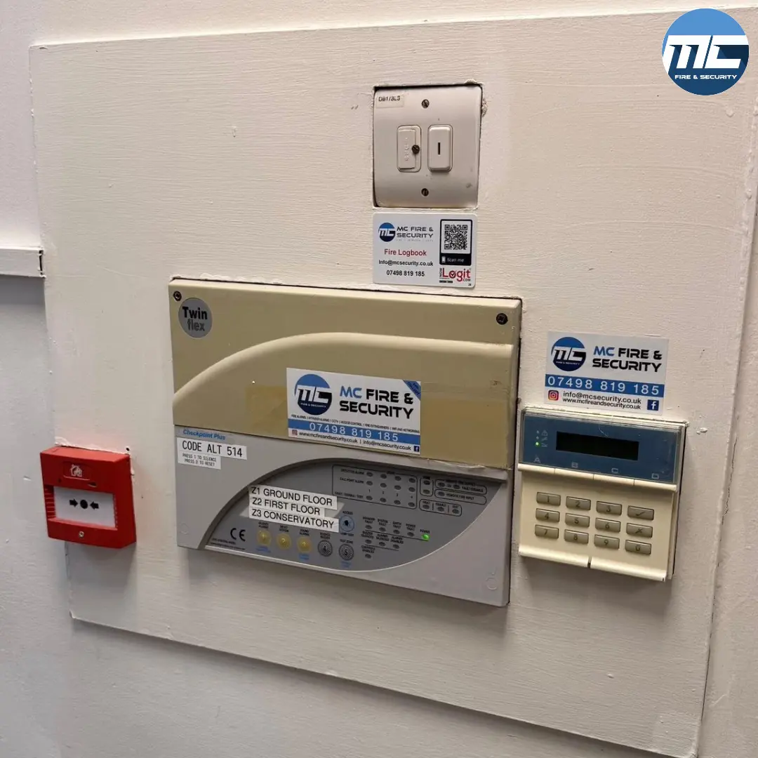 MC Fire & Security branded fire alarm panel and intruder keypad — Amélie Porthleven