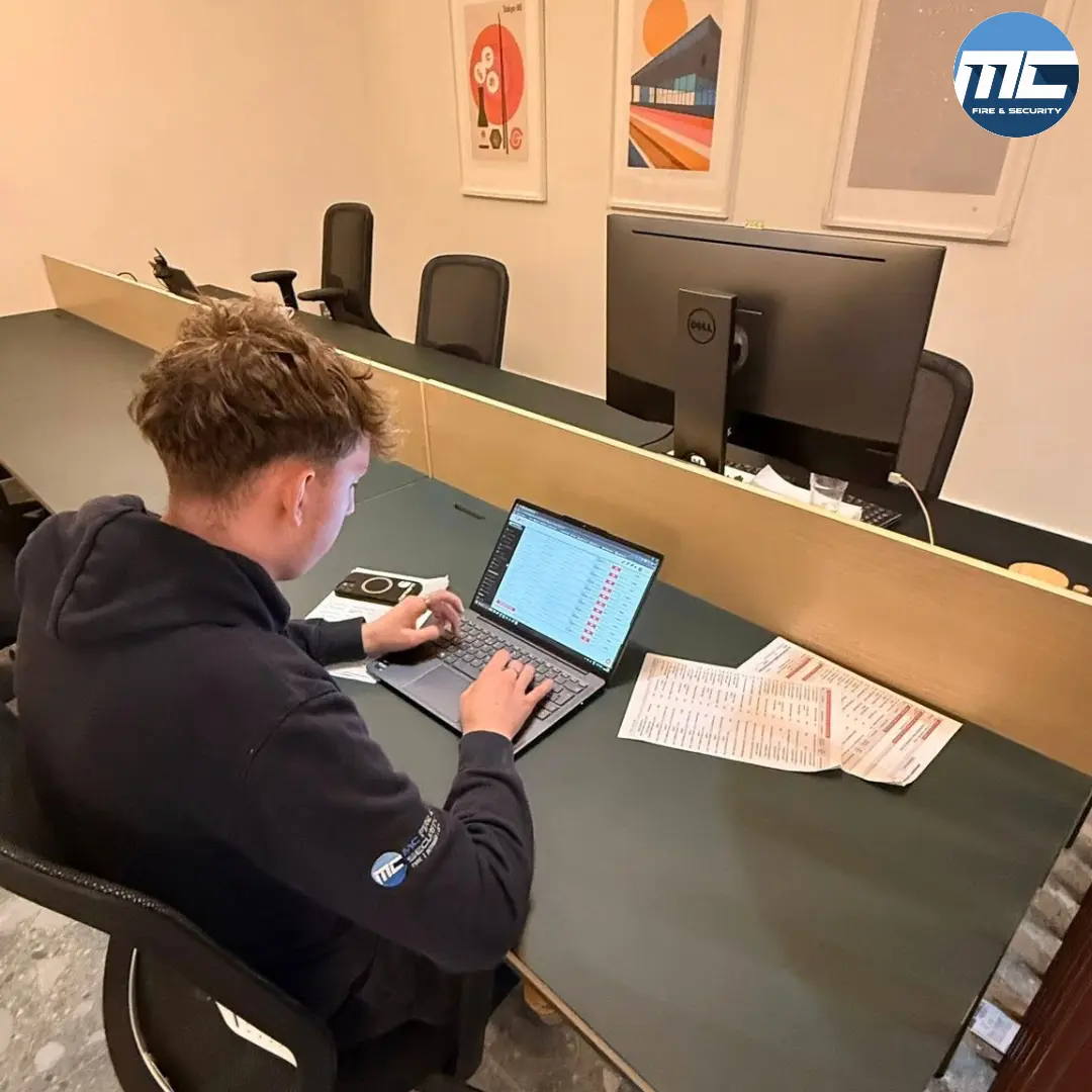 MC Fire & Security engineer documenting emergency lighting test results