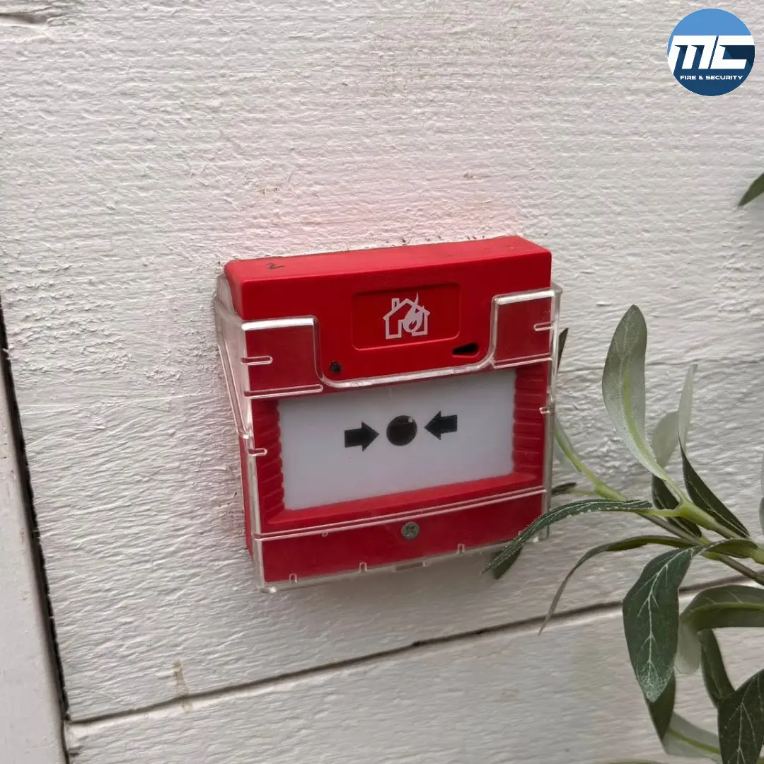 Wireless fire alarm manual call point on painted timber — Amélie restaurant Porthleven