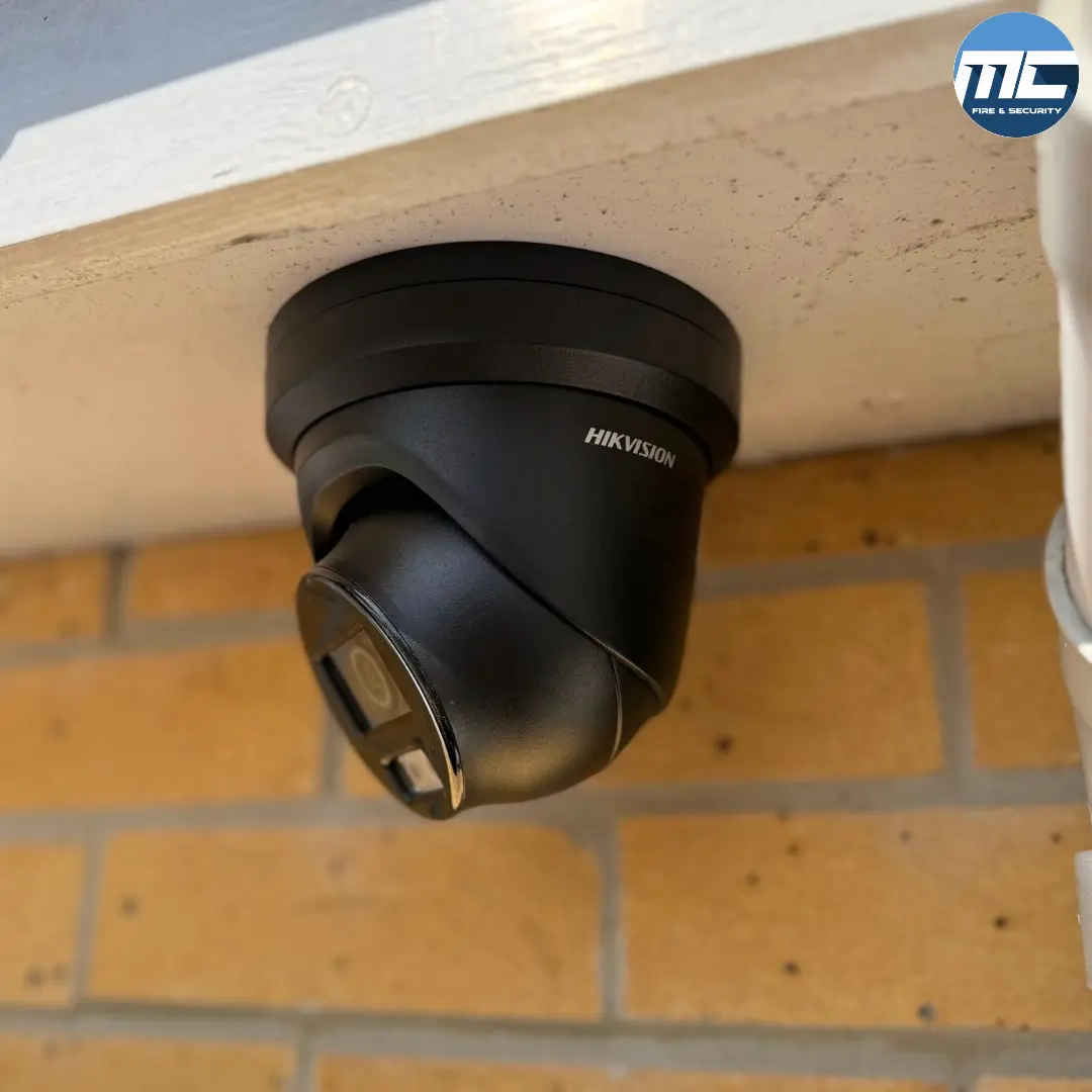 Hikvision turret CCTV camera mounted on brick wall in Cornwall