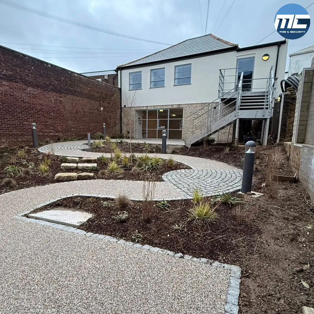 External fire-escape staircase with compliant emergency lighting