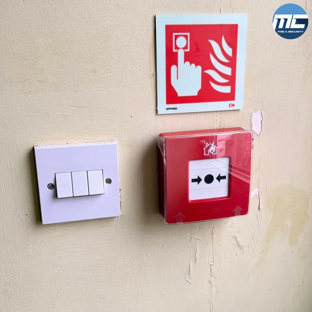 Manual fire alarm call point next to light switch — Marazion install