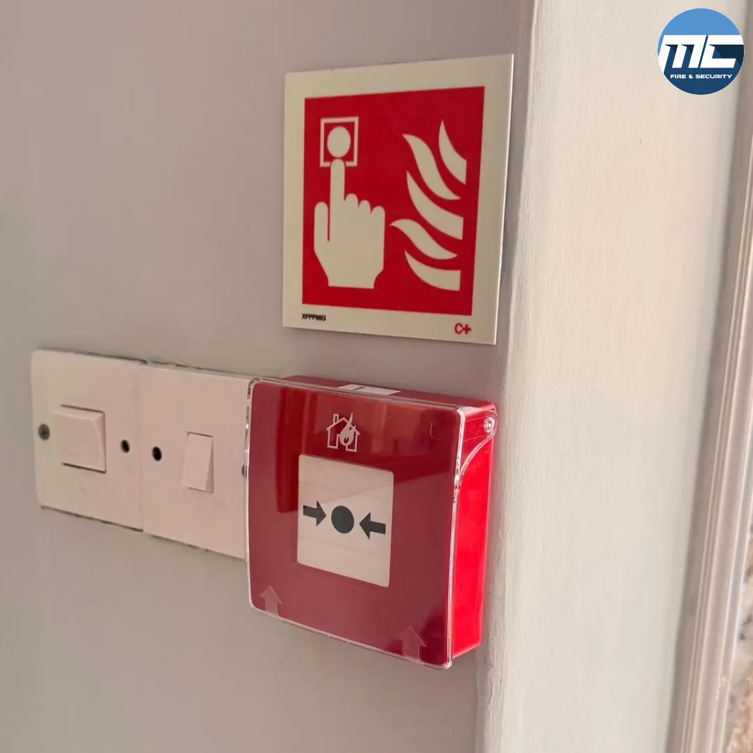 Manual call point with fire alarm action sign