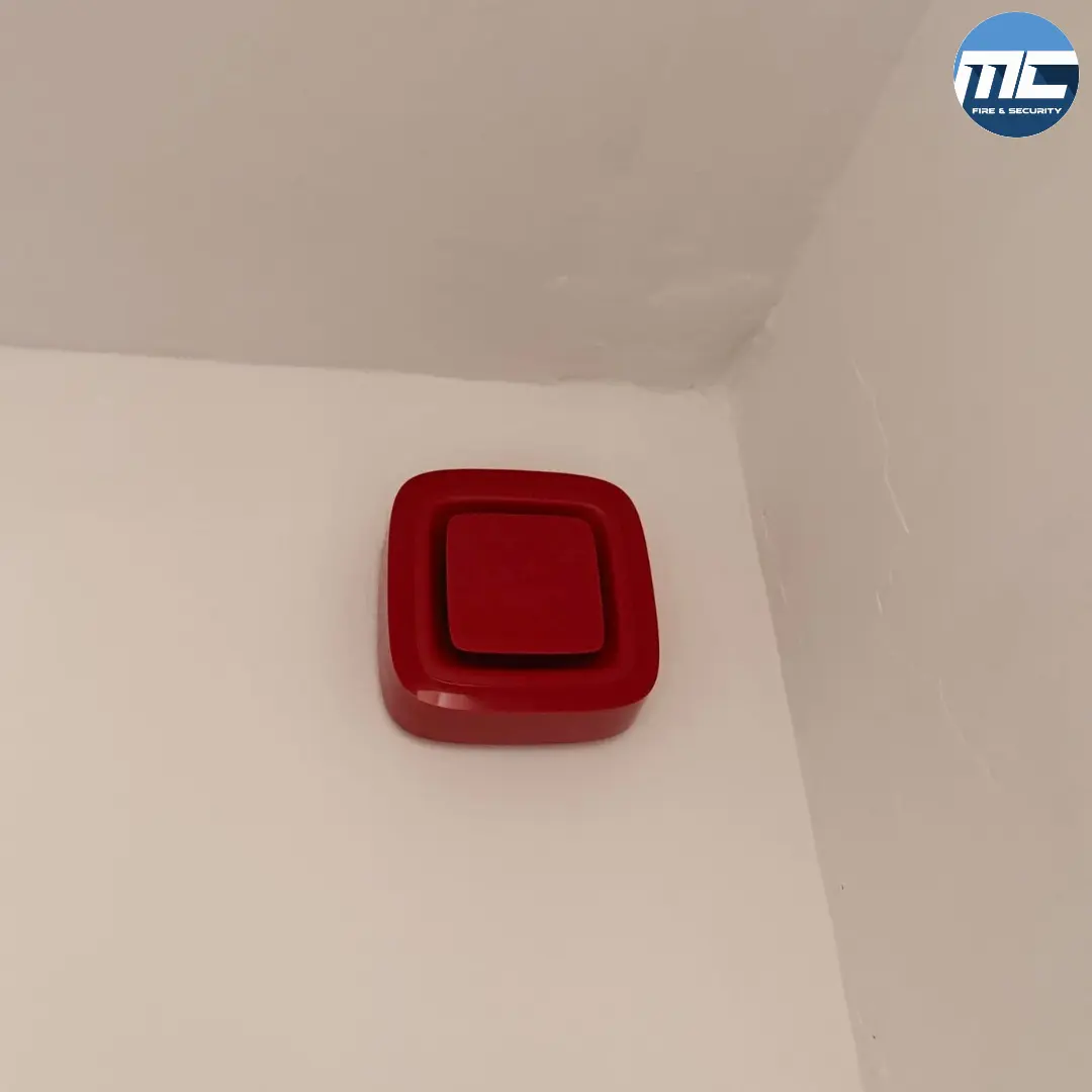 Red ceiling-mounted fire alarm sounder