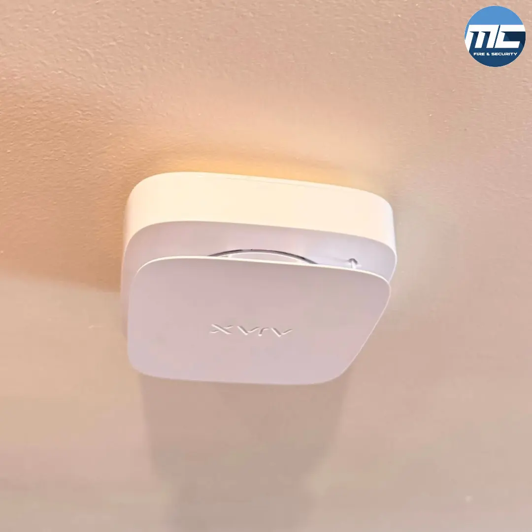 Wireless Ajax fire sounder ceiling-mounted in warm interior — Marazion