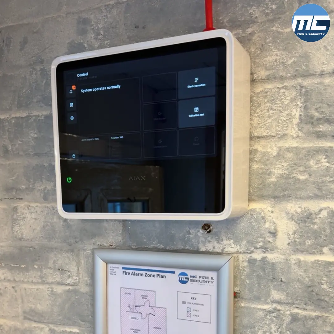 Wireless Ajax fire alarm tablet and zone plan at a Cornwall industrial property — installed by MC Fire & Security