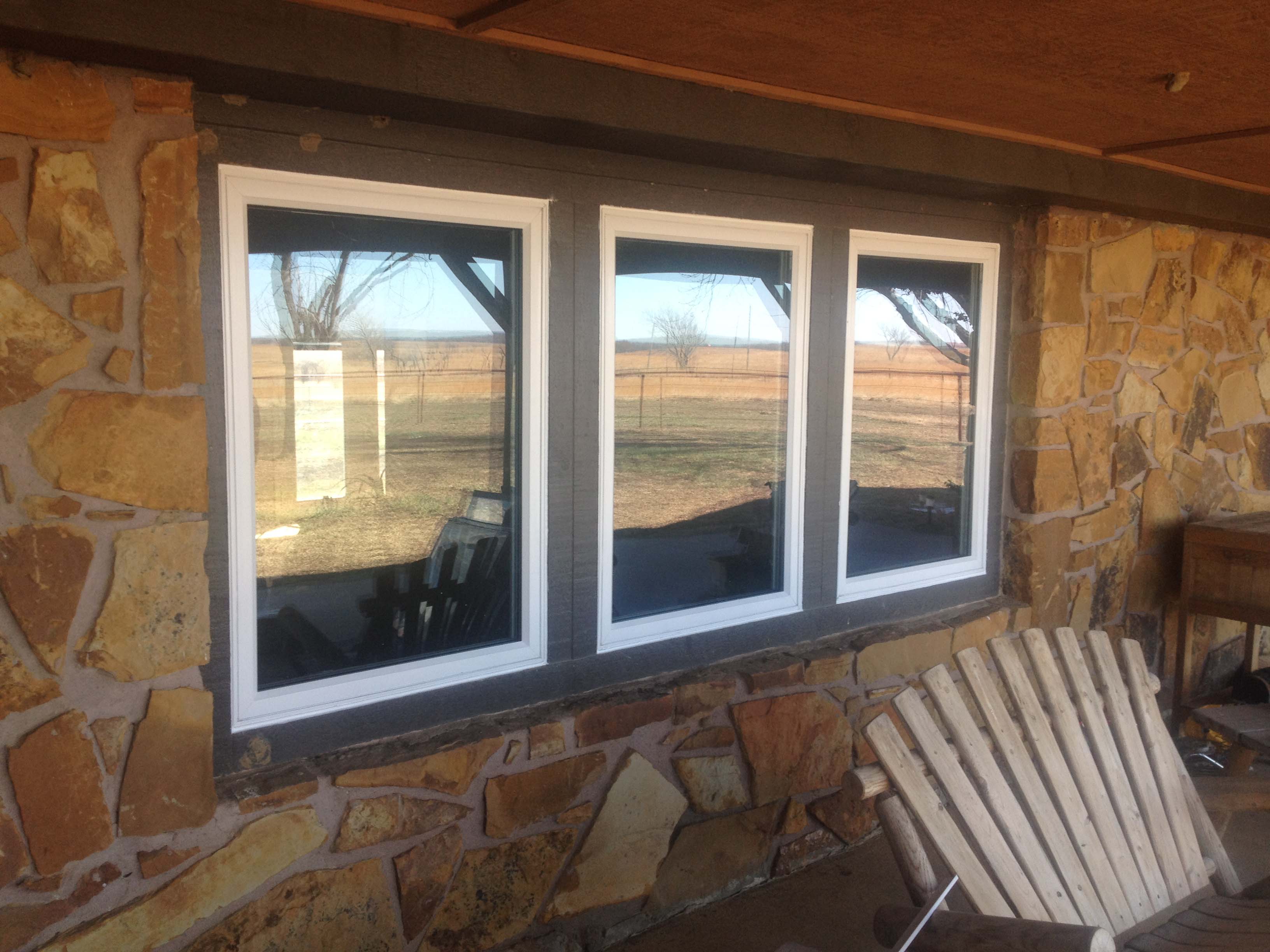 Vinyl replacement windows on a Tulsa house