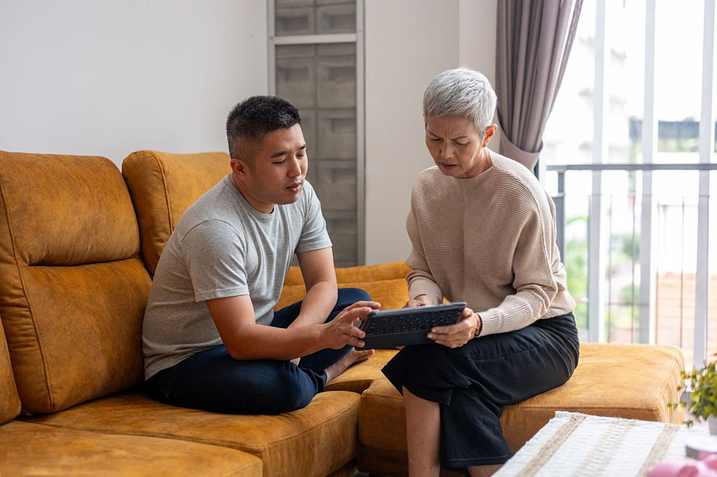 A woman overwhelmed by the administrative burden of managing an estate after a loss