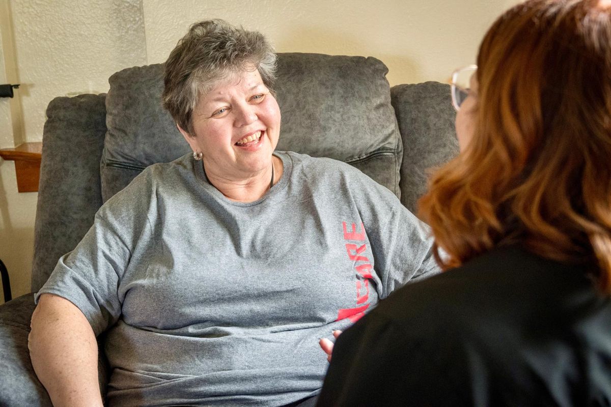 Med1Care caregiver sharing a laugh with a client at home
