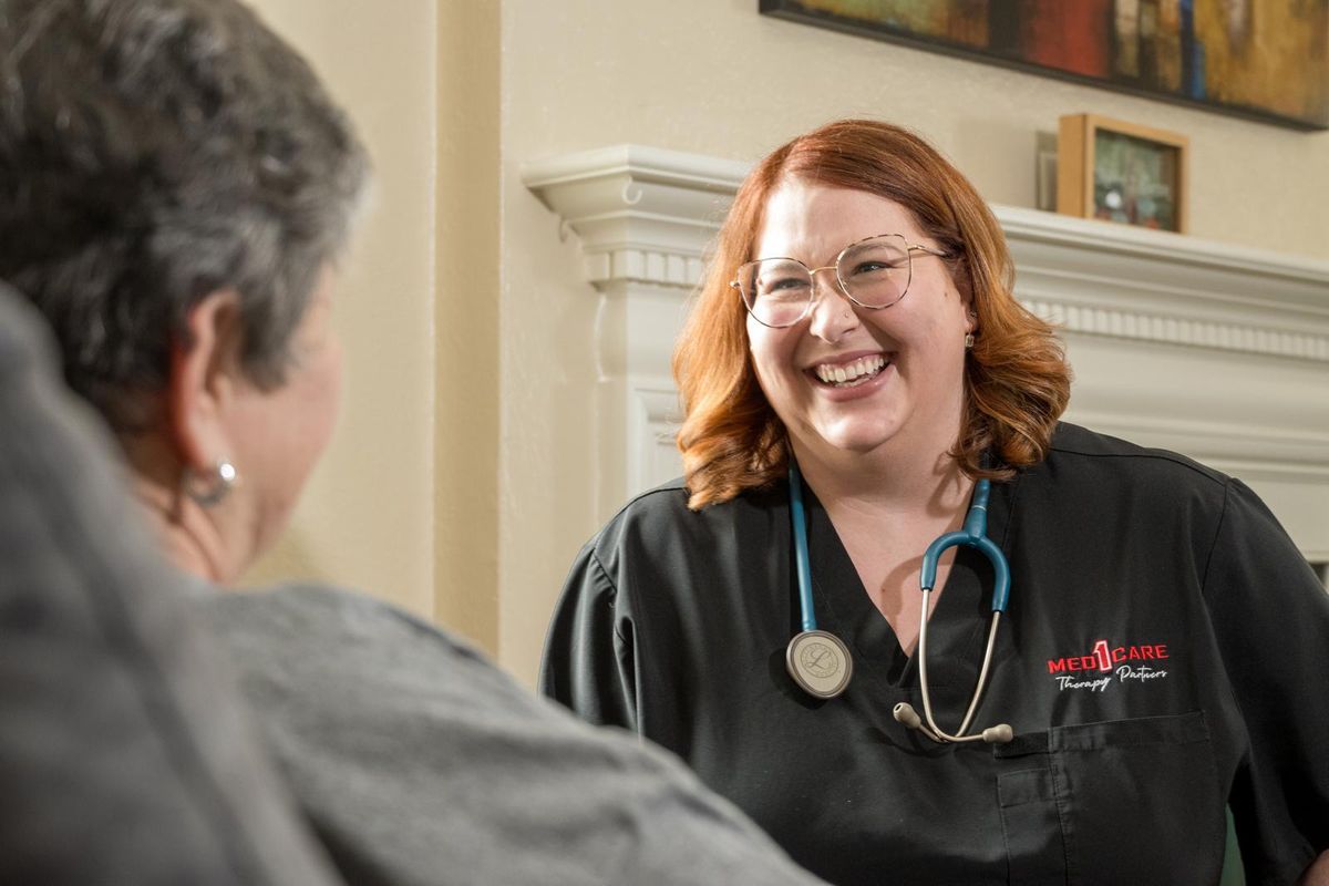 Med1Care nurse with a client at home