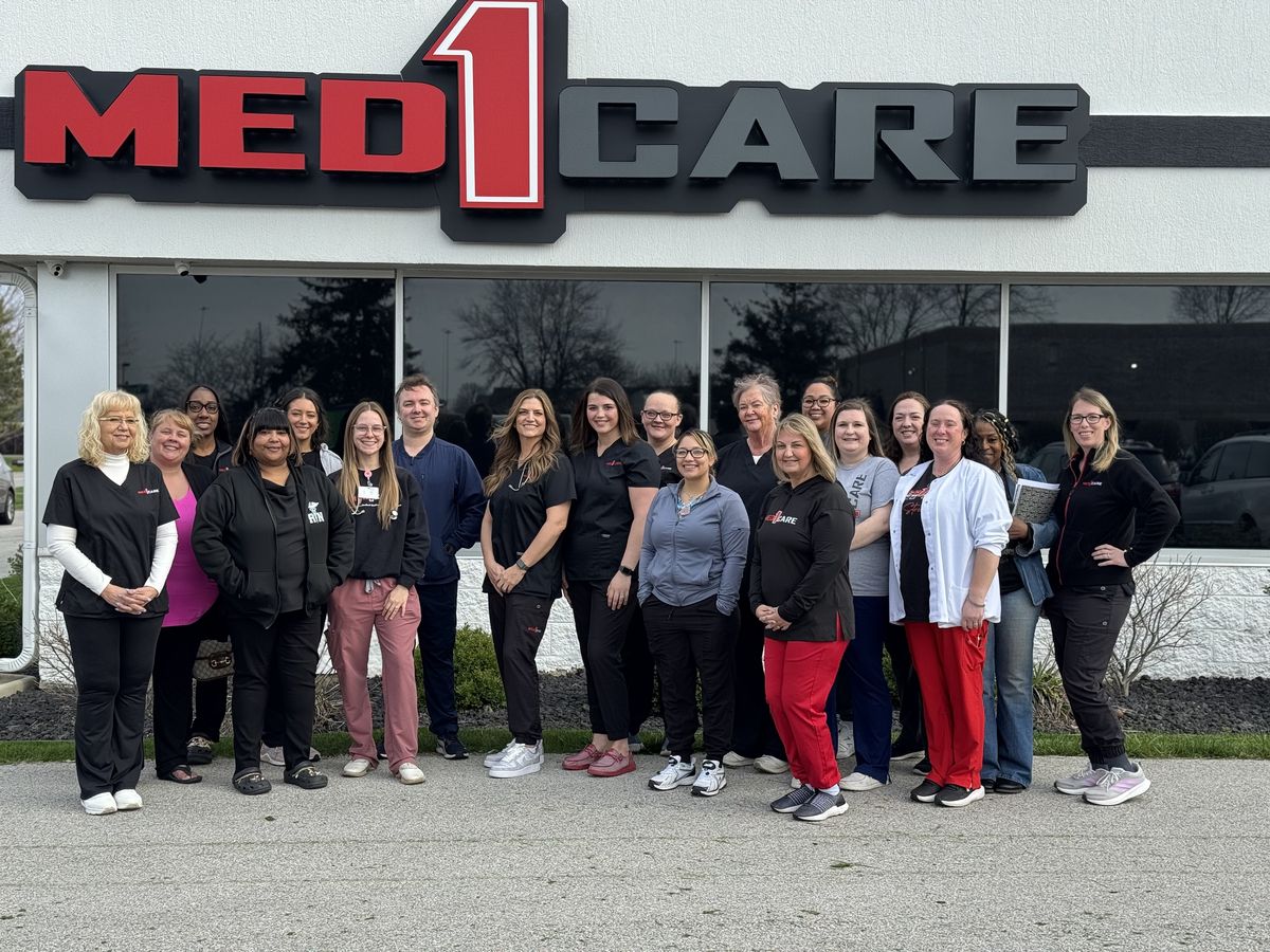 Med1Care team outside the corporate office