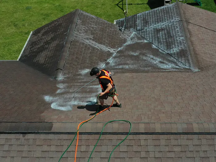 Roofing professional refreshing a roof