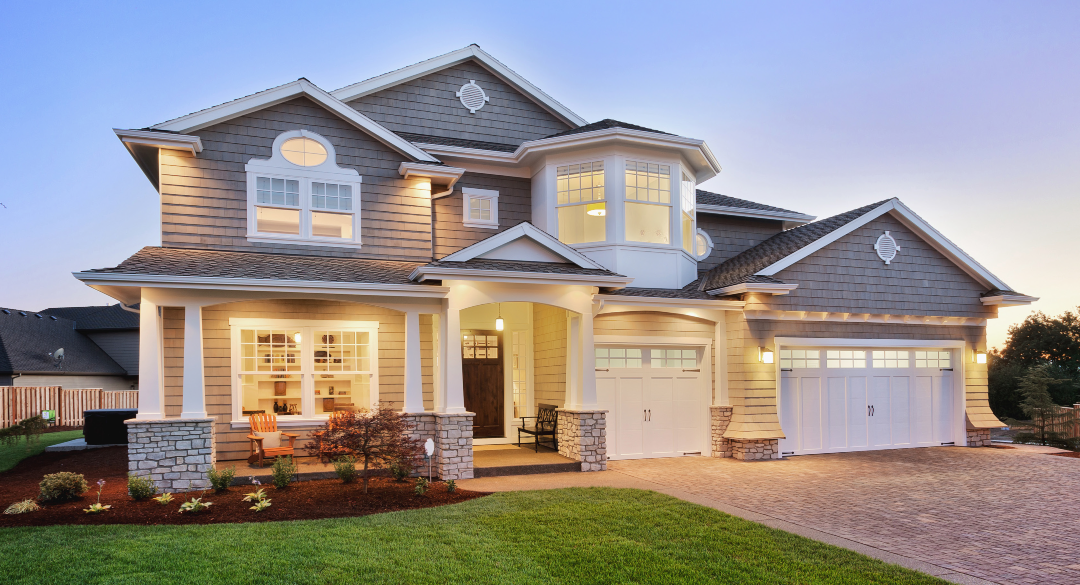 Buying a home in Central Arkansas — modern house exterior at dusk