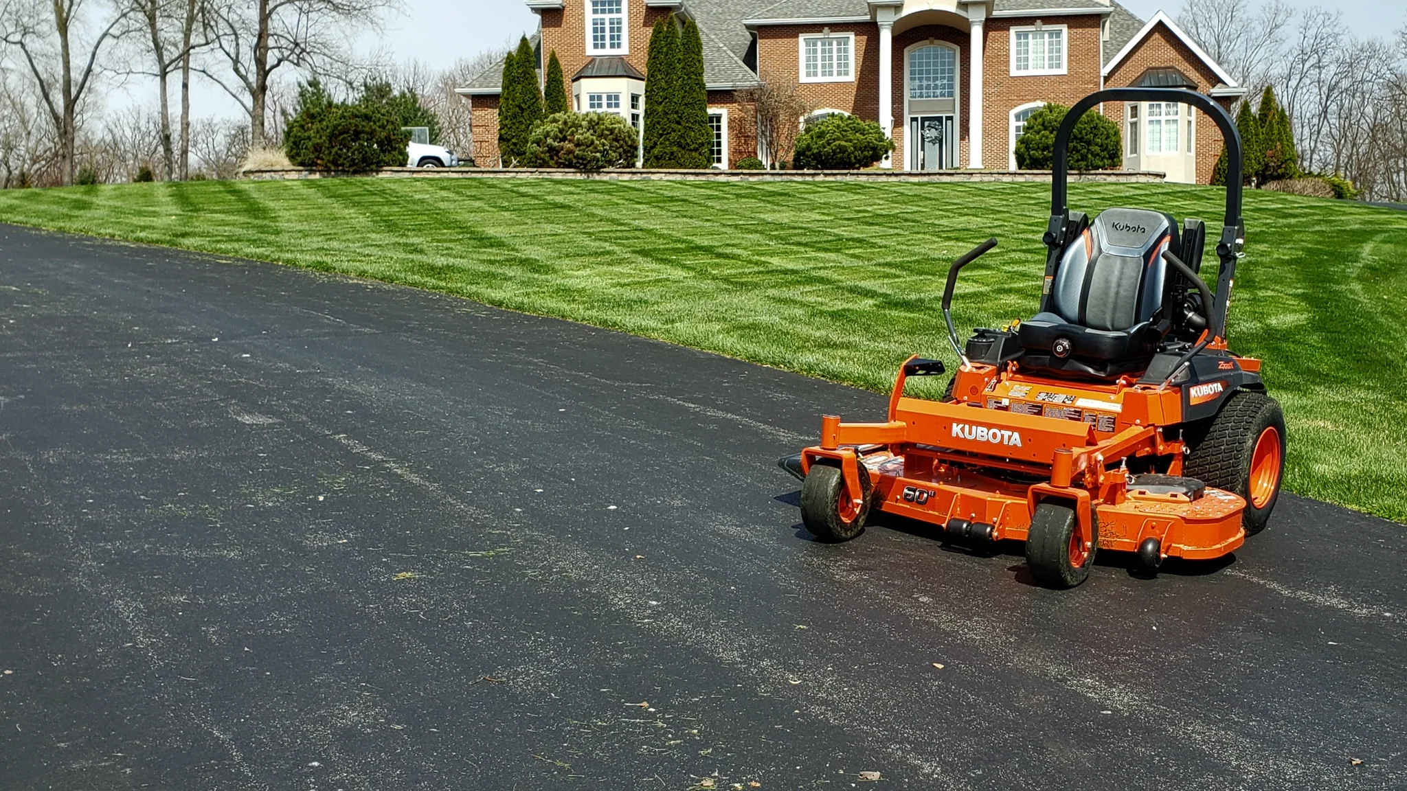 Professional lawn care crew maintaining a lush green property in Winchester, VA