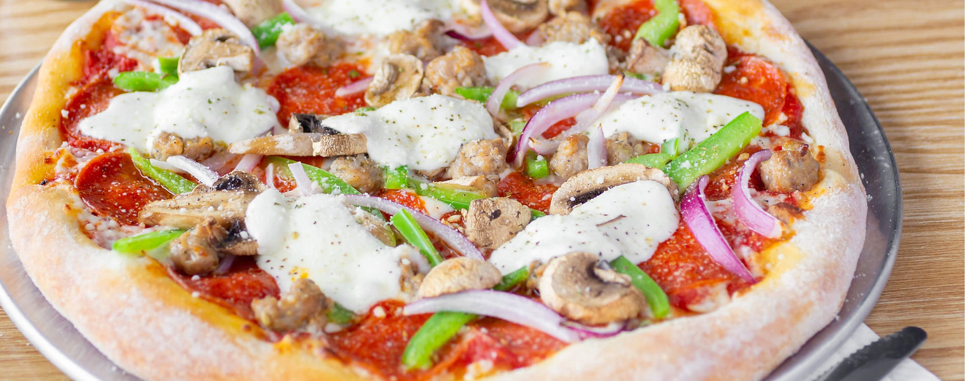 Italian pizza at Pasta Party Orange CA including Margherita Meat Lovers and build your own