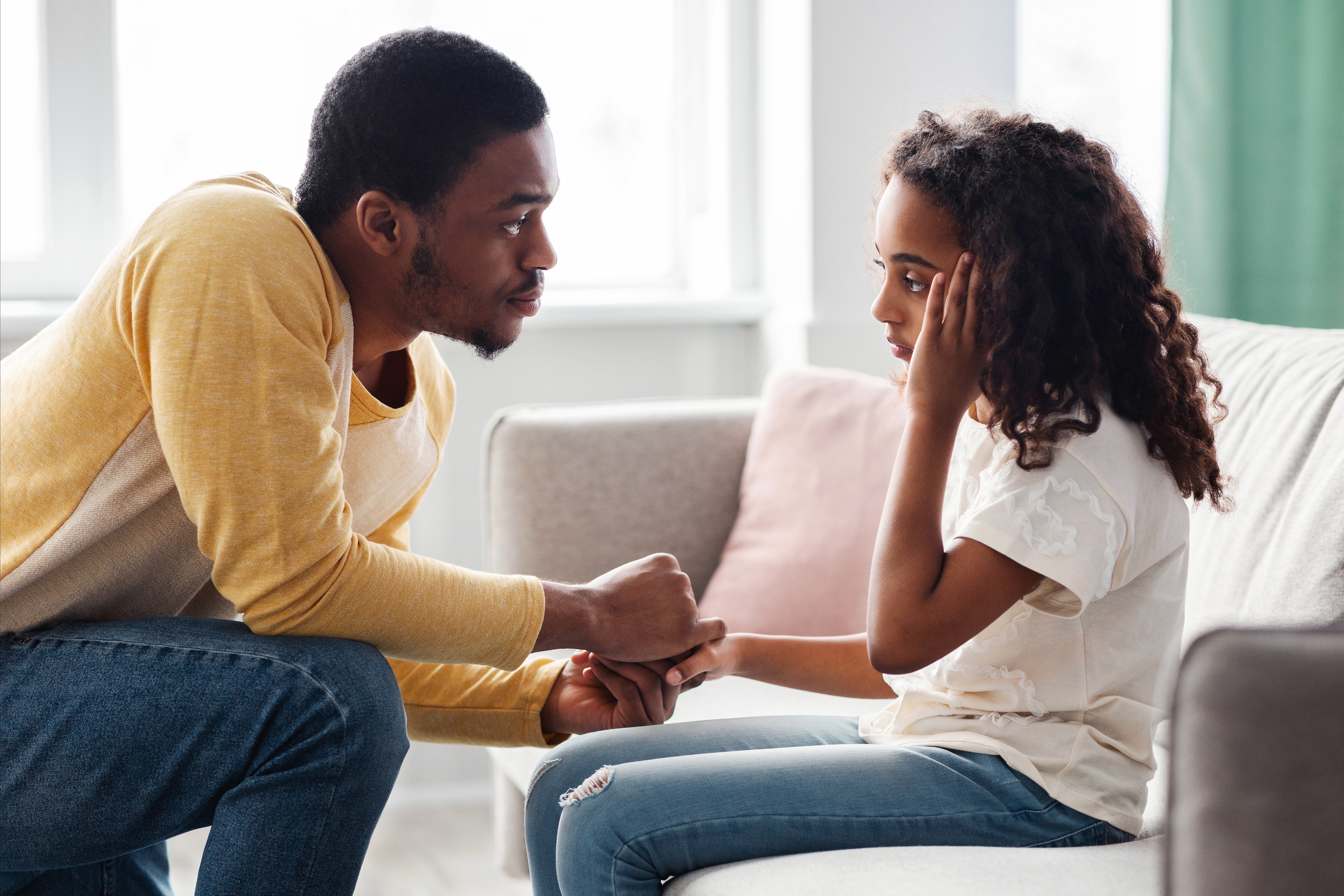 Dad and daughter having a calm, connected conversation