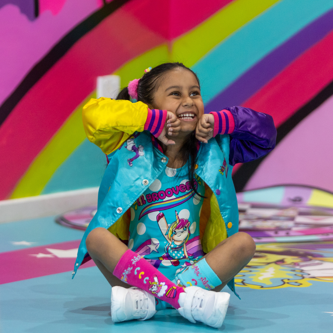 Two preschoolers from Base 181 Studios' preschool dance classes performing a hip hop and break dance move. Smiling kids enjoying dance classes for children