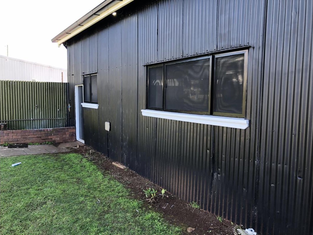 Black framed sliding windows with stainless steel screens