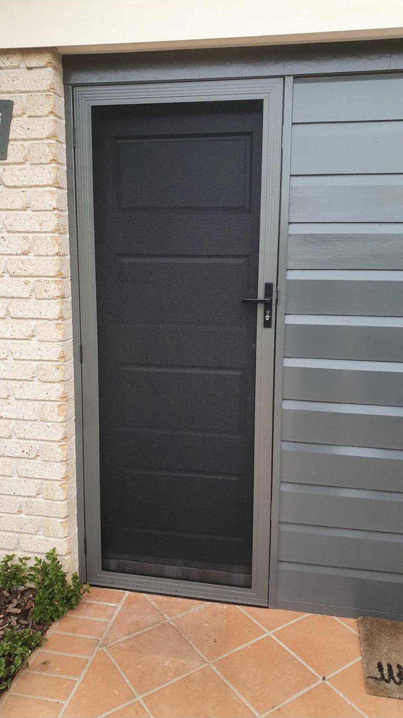 Hinged SecureView security door in Monument, colour matched to the front door