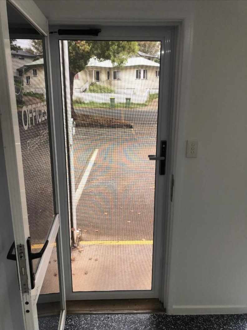 Looking out through a SecureView hinged security door from inside the Darling Downs Glass & Security shop on Mort Street