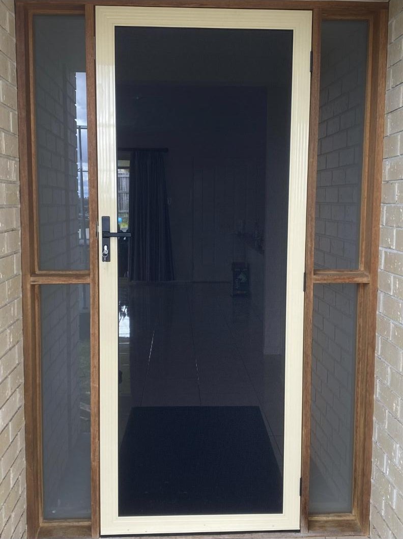 Hinged SecureView security door in Primrose