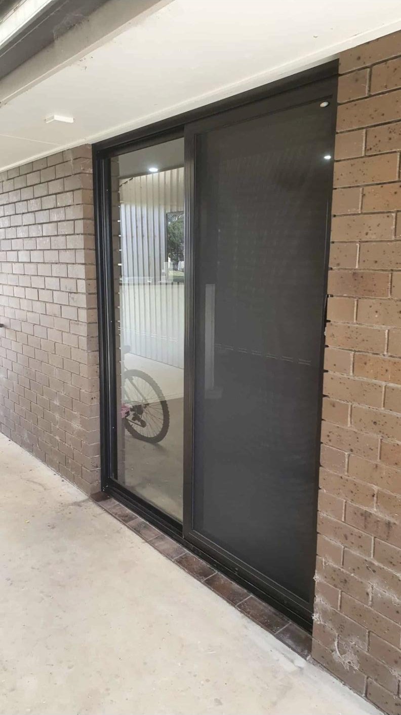 Black framed SecureView sliding security door