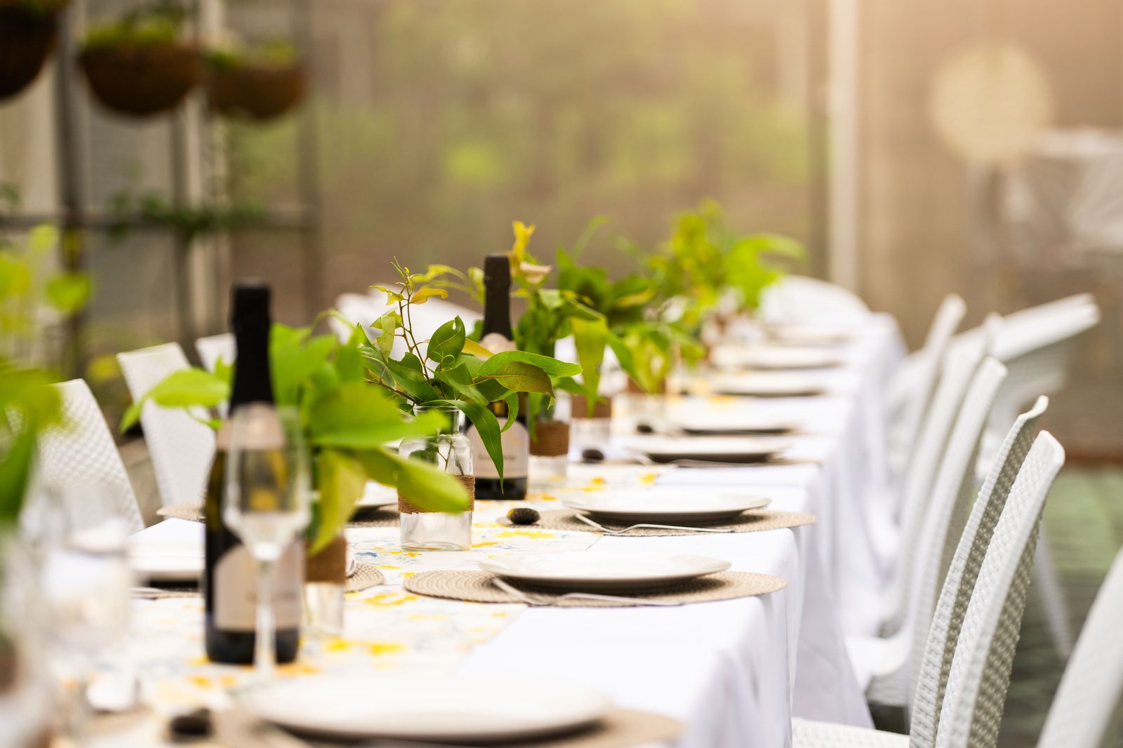 Table setting with native greenery centrepieces